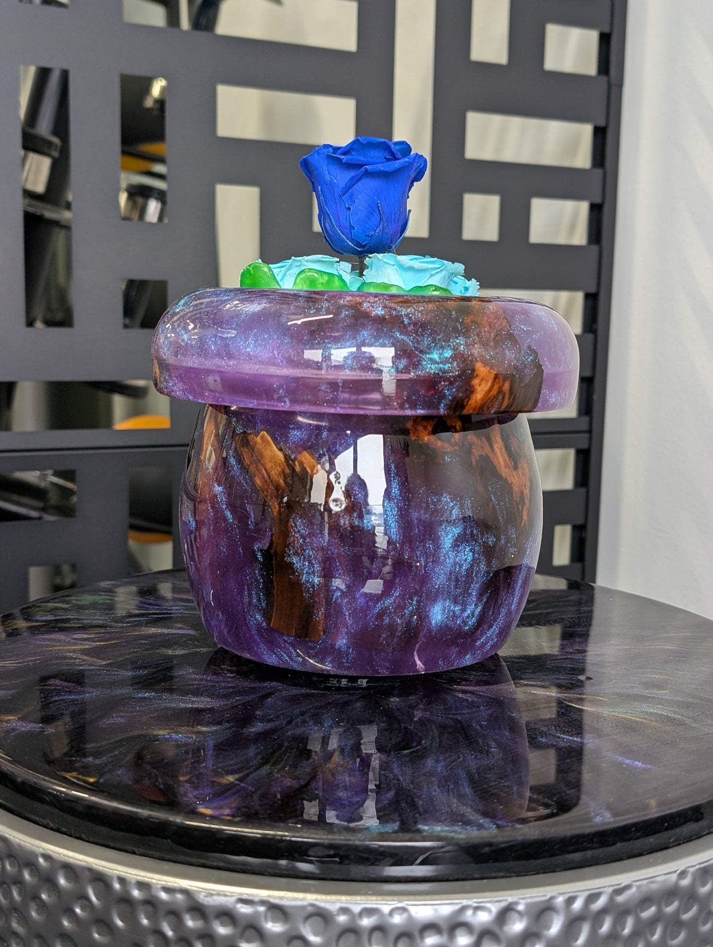 Purple vase with preserved roses