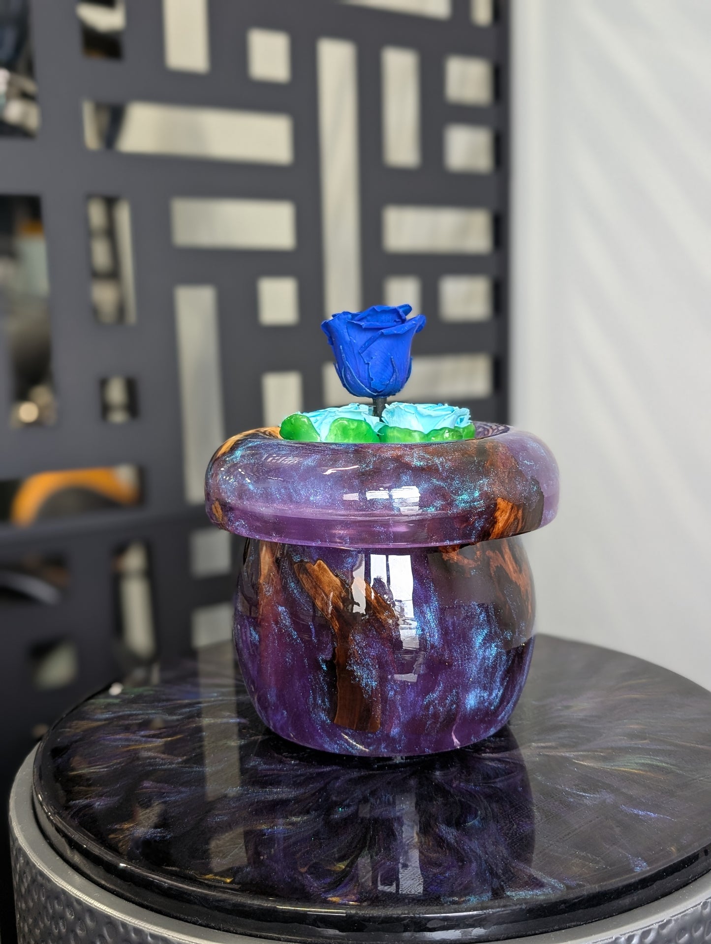 Purple vase with preserved roses