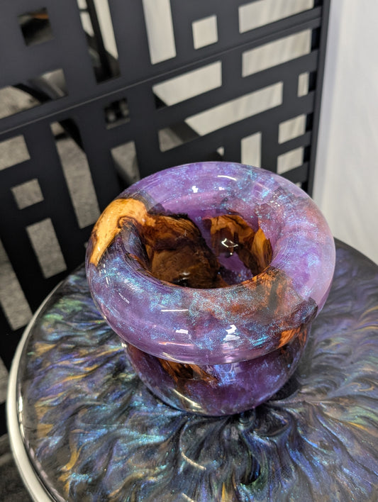 Purple vase with preserved roses