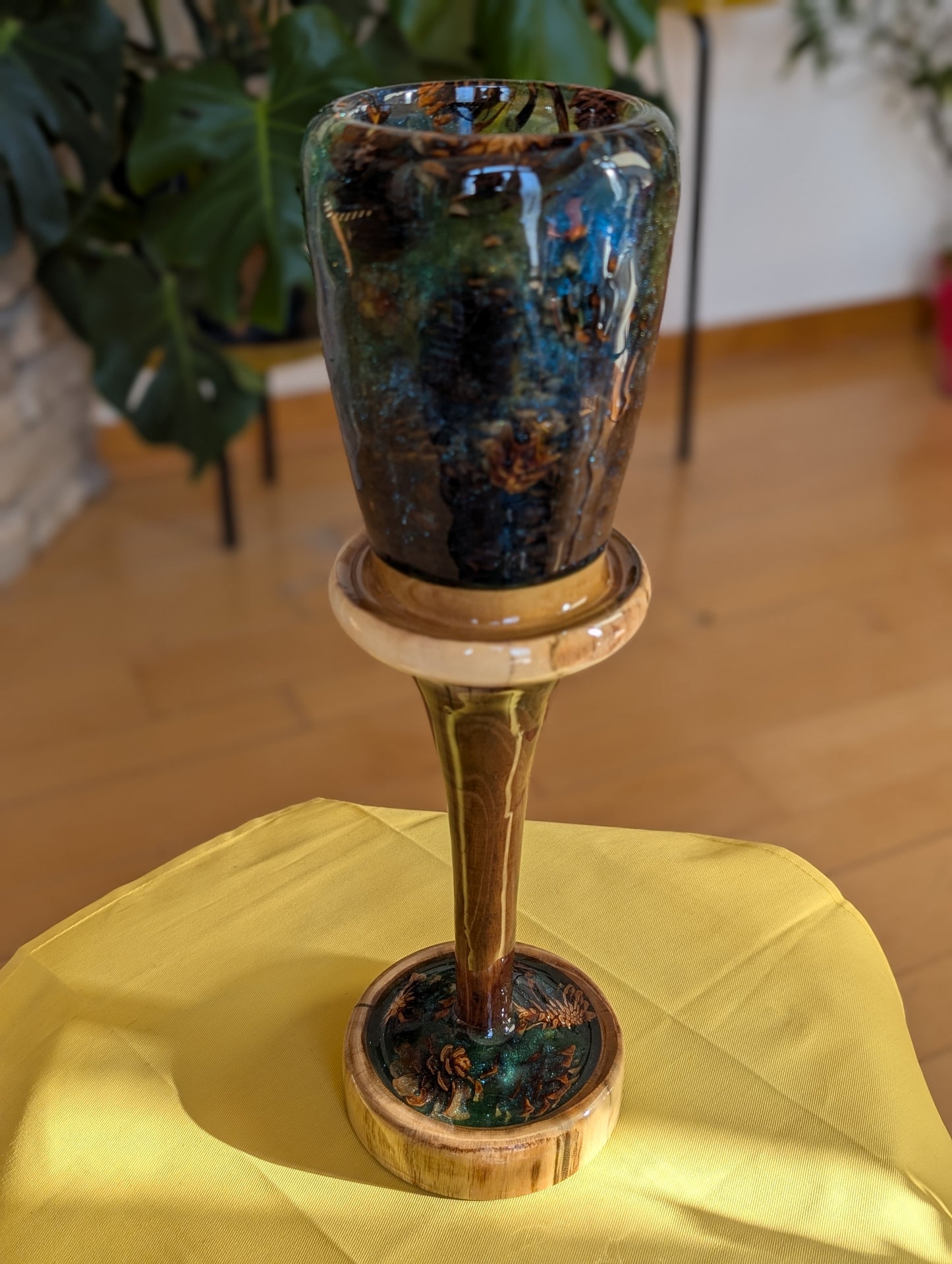 Tall vase made of wood, pinecones and epoxy.